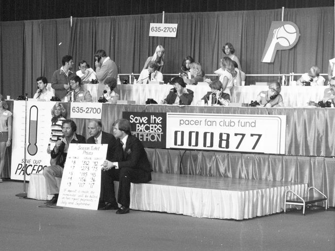 Gary Todd, 1070-WIBC radio morning man, Indianapolis Mayor Bill Hudnut and Chet Coppock, TV sportscaster show the ticket chart during the "Save the Pacers" Telethon in July 1977. (IndyStar File Photo) 