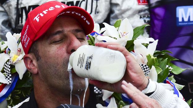 Tony Kanaan enjoying the historical taste of victory after winning the 2013 Indy 500.