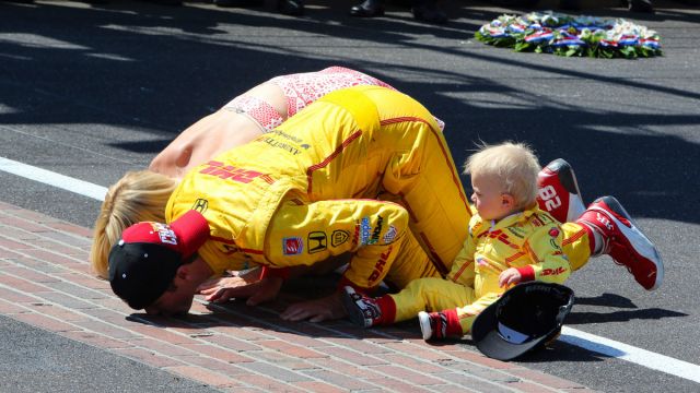 Ryan Hunter-Reay and his family kiss the bricks after his 2014 win.