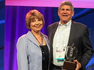 Radio Ink Publisher Deborah Parenti with Emmis Chairman/CEO Jeff Smulyan, the 2016 Radio Wayne winner for America’s Best Broadcaster